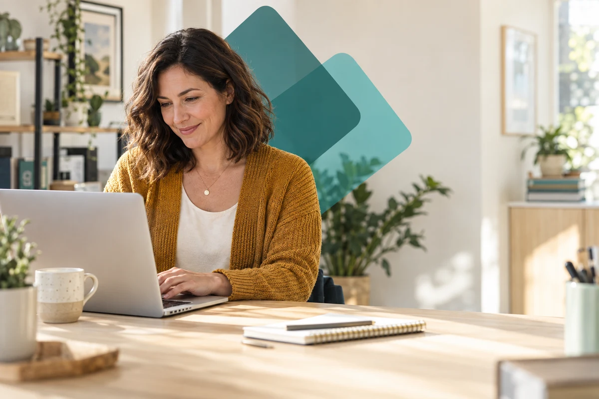 Business owner working at her laptop in a bright office, with layered teal rounded squares